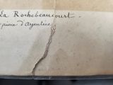 a piece of paper with writing on it sitting on a table