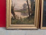 two framed paintings on the wall next to each other
