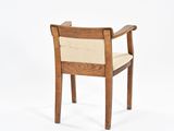 an image of a wooden chair with a beige upholstered seat