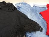 three pairs of black and red shirts and jeans on a white surface