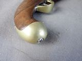 a close up of a gun that is on a table