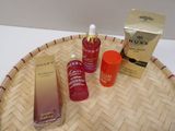 bottles of skin care products sitting on top of a bamboo tray