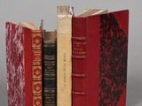 three books that are sitting on a table together