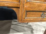 a close up of a desk with a drawer on top of it