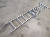 a metal ladder that is laying on the ground