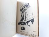 an open book with a drawing of a man on a skateboard