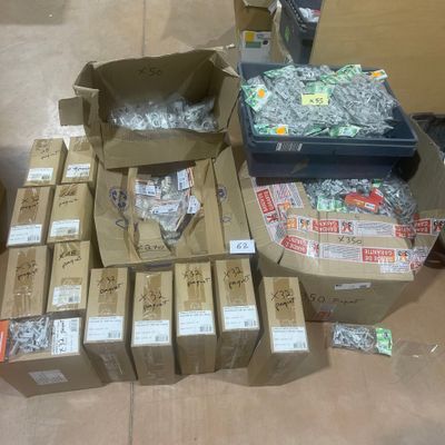 many boxes of assorted items sitting on the floor