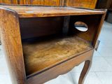 a small wooden table with a drawer on it