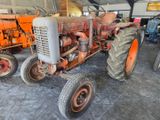 a tractor that is parked in a garage