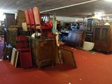 a room filled with lots of furniture and a lot of chairs
