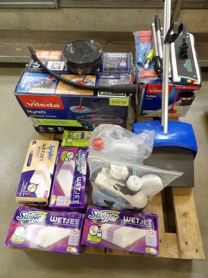 a pile of cleaning supplies on a pallet in a store