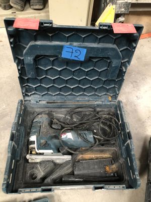 a tool box with tools in it sitting on the floor
