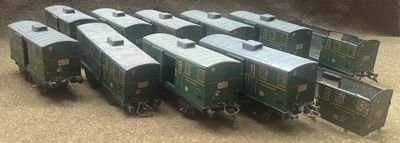 a lot of toy trains that are sitting on the ground