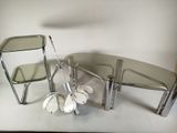 two chairs and a table that are sitting on a table
