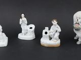 five figurines of animals that are sitting on a table