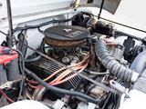 a picture of a car engine with its hood open