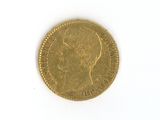 a gold coin with a picture of a man on it