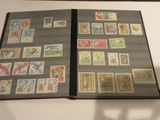 a book with stamps on it sitting on a table