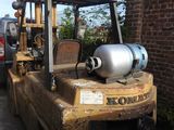 a forklift with a tank on the back of it