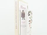 deux livres posés côte à côte sur une surface blanche
