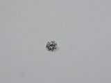 a close up of a single diamond on a white surface