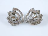 pair of diamond earrings on a white background