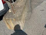 a shadow of a person on a skateboard in a parking lot