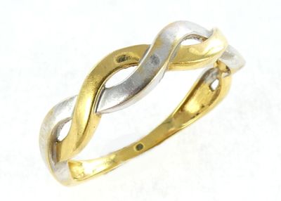 an image of a gold and silver ring on a white surface