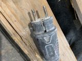 a plug that is plugged into a piece of wood