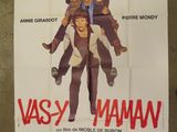 the poster for the movie vasy mamma is hanging on the wall