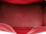 the inside of a red purse with a zipper on it