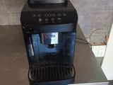 a coffee machine sitting on a table in a kitchen