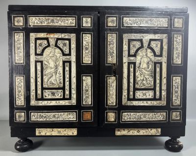 a black and white cabinet with two doors and two drawers