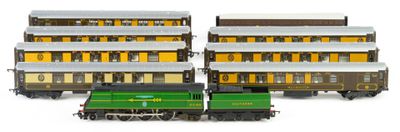 two trains that are sitting next to each other on the tracks