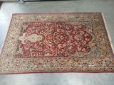 an oriental rug on the floor in a room