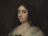 portrait of a woman in a black dress with a white collar