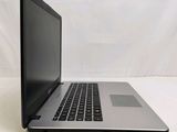 an open laptop computer sitting on top of a white table