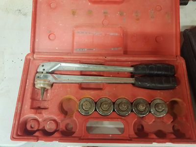 a tool set in a red case on a table