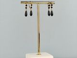 a white marble table topped with a gold and black lamp