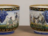 two cups that are sitting on a table