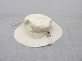 a white hat that is laying on a table