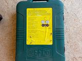 a green case with a yellow label on it