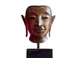 an image of a statue of a person ' s head on a stand