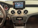 the dashboard of a car with a tablet on the dashboard