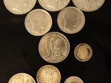 a lot of coins that are on the table