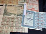 several different types of old paper are on a black table