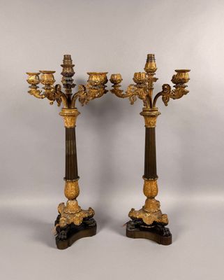 a pair of antique bronze and marble candelabs