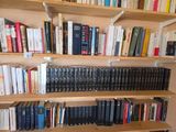 many books on the shelves in the room