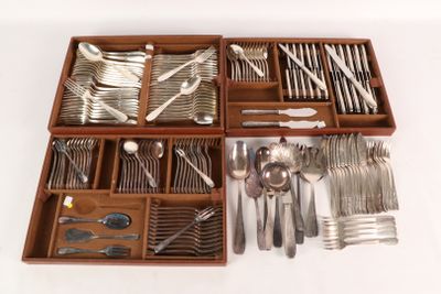 a wooden tray with silverware in it on a white surface