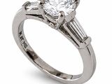 a close up of a diamond ring on a white background